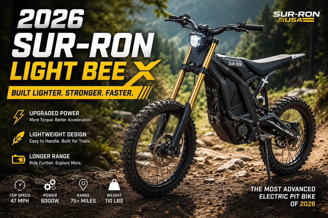 2026 Sur-Ron Light Bee X electric pit bike parked on a rugged forest trail highlighting its lightweight aluminum frame, long-travel suspension, and off-road performance.