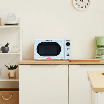 Nostalgia Retro Compact Countertop Microwave Oven - 0.7 Cu. Ft. - 700-Watts with LED Digital Display - Child Lock - Easy Clean Interior - Orange