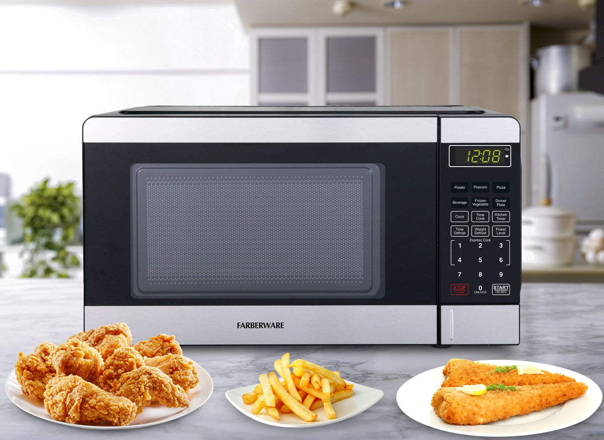 Farberware Countertop Microwave Ov 1100 Watts, 2.2 cu ft - Smart Sensor With LED Lighting and Child Lock - Perfect for Apartments and Dorms - Easy Clean Black Interior, Stainless Steel